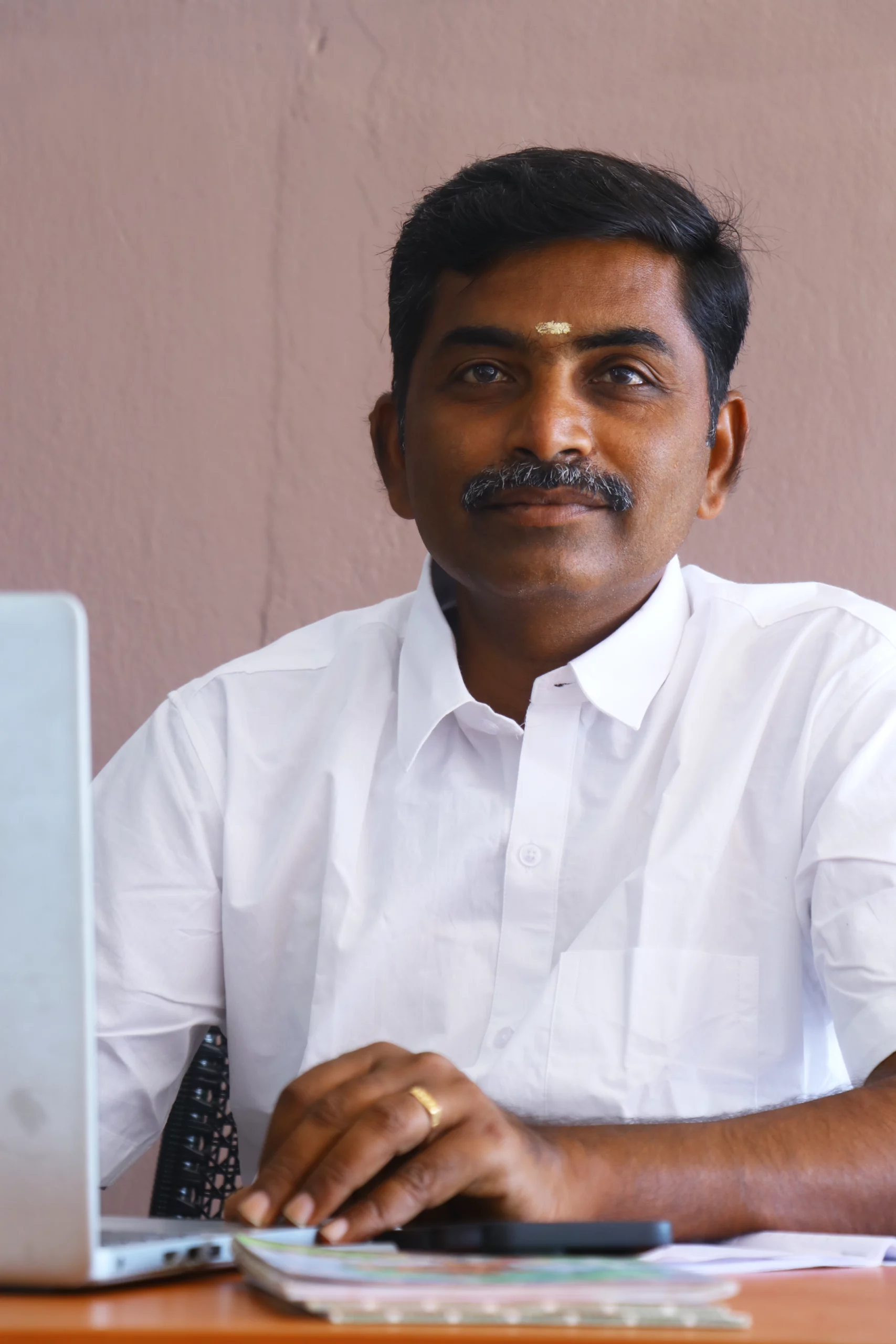 Mr. R. Thirumoorthy M.com.,